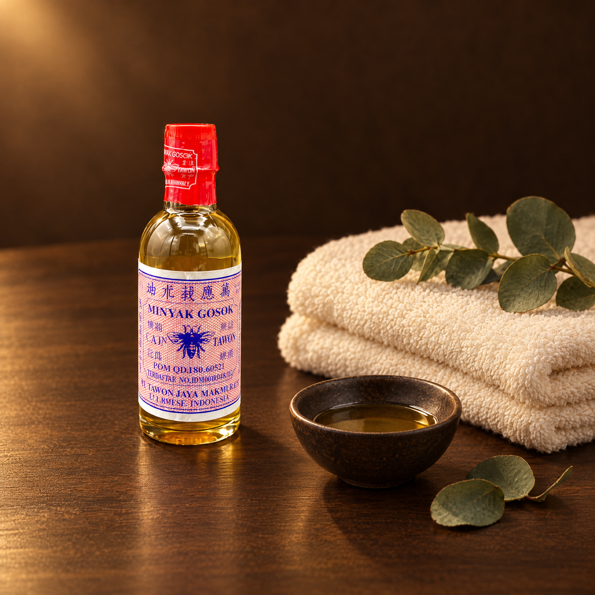 Tawon Minyak Gosok EE 56ml – Flasche mit Handtuch und Eukalyptus