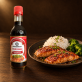 Kikkoman Teriyaki Marinade 500 ml – Flasche mit Teriyaki-Lachs